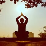 Person practicing mindfulness meditation for stress relief